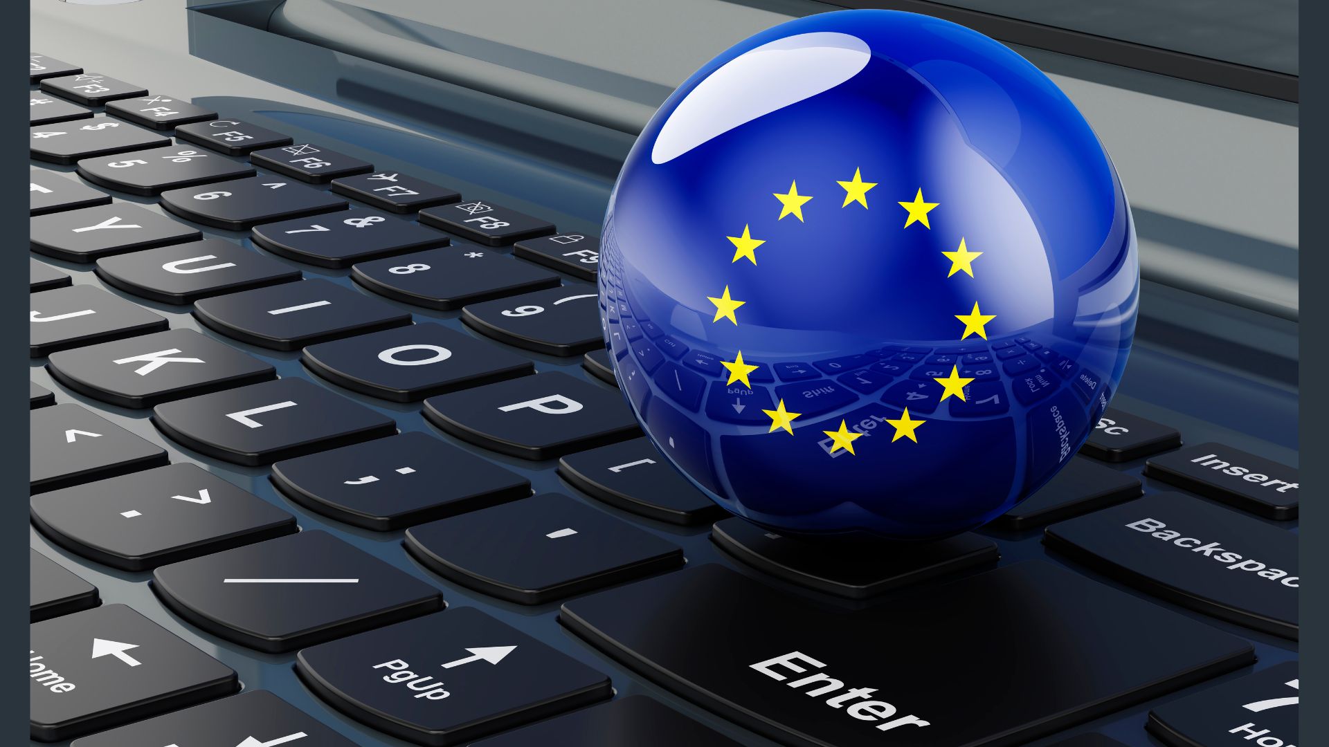 Le drapeau de l'UE trône au sommet d'un clavier d'ordinateur, symbolisant l'intégration des valeurs de l'Union européenne dans le marché du travail numérique.